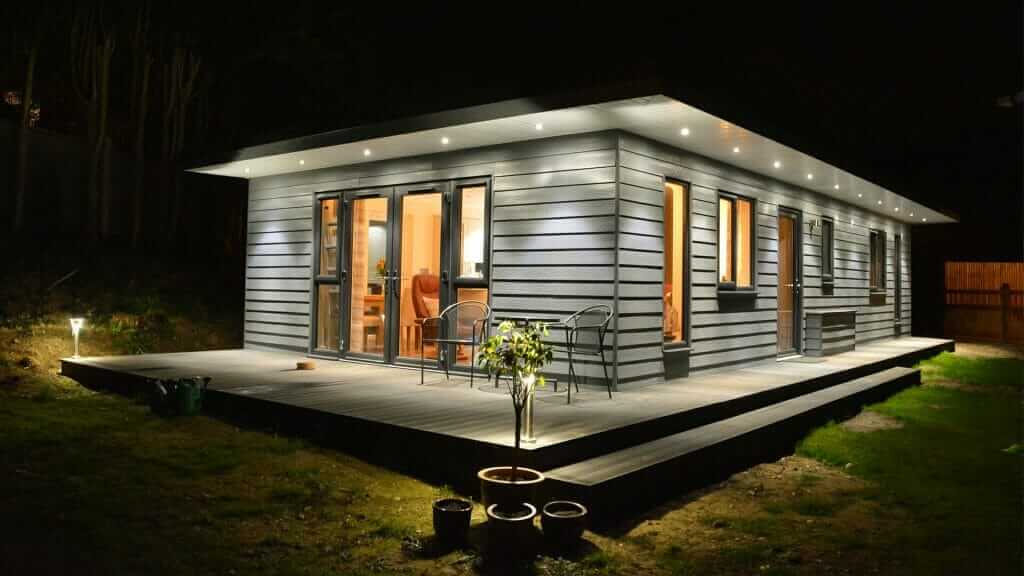 granny annexe ideas image shows a granny annexe with composite decking on the outside